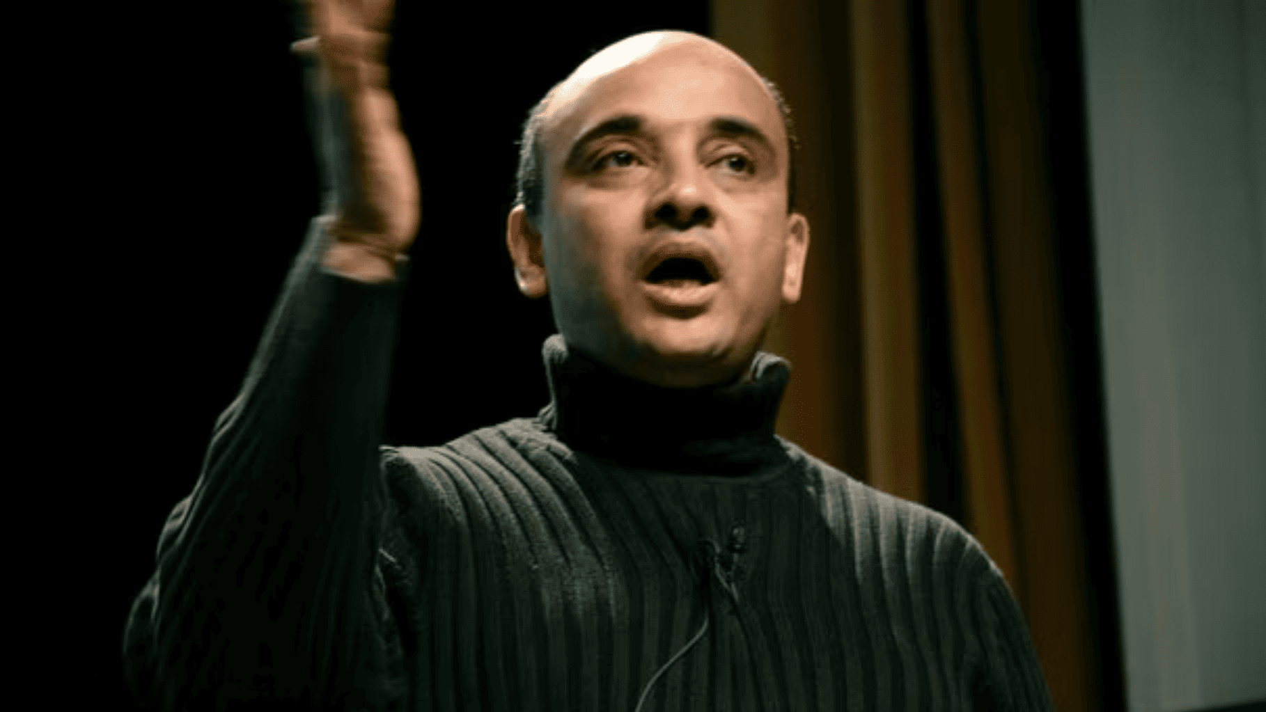 Kwame Anthony Appiah, a dark-skinned man wearing a turtleneck